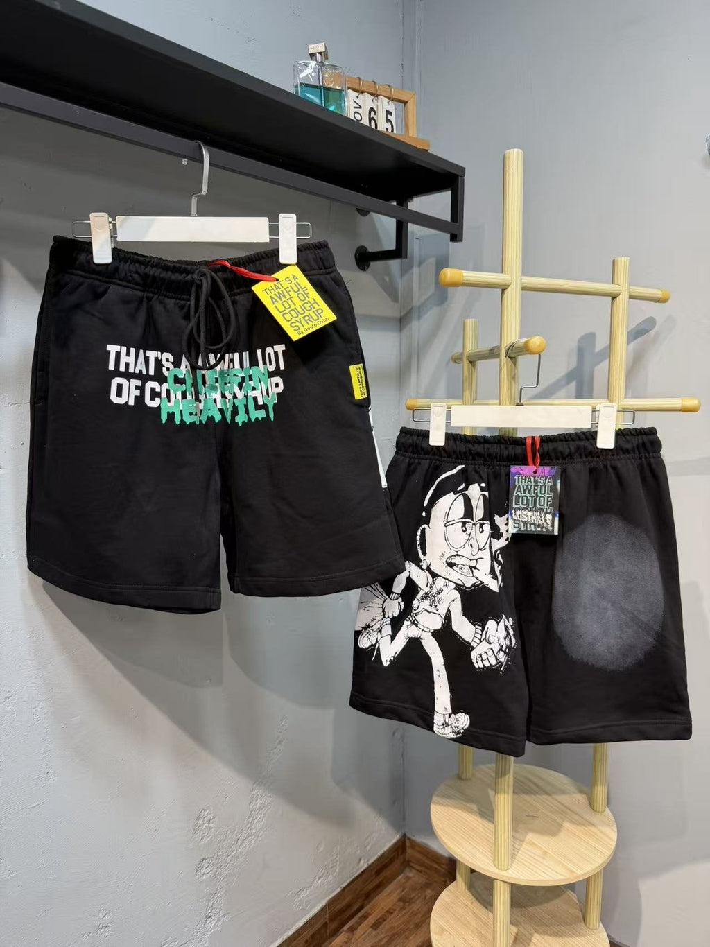 THAT'S A AWFUL LOT OF COUGH SYRUP Cartoon Back Graphic Shorts