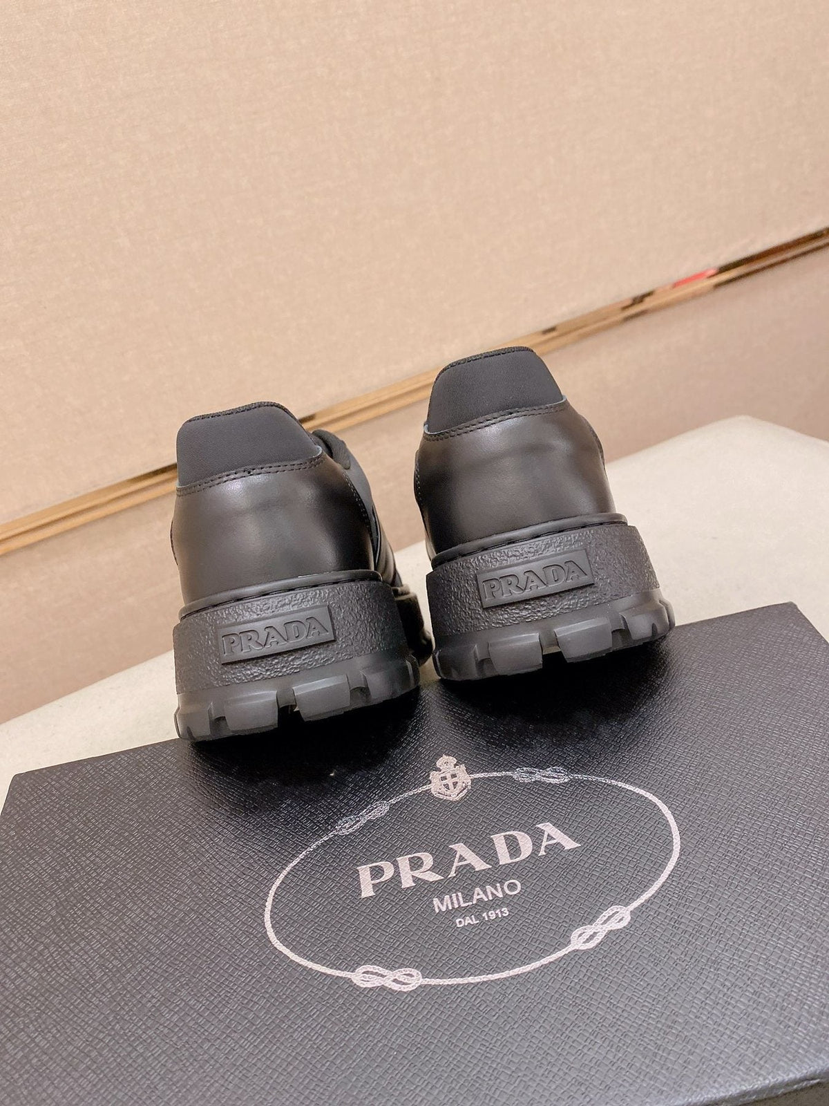 Prada Triangle Plaque Low-Top Sneakers - Treaded Rubber Sole